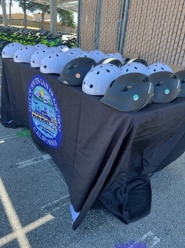 Image of bike helmets on table.