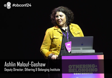 image of speaker at Othering and Belonging Conference, Links to video of conference..